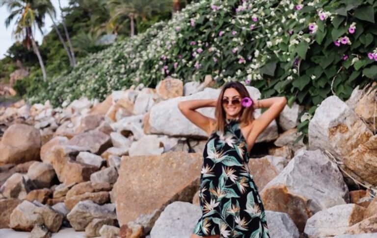 a young woman wearing dress with tropical pattern a young woman wearing dress with tropical pattern