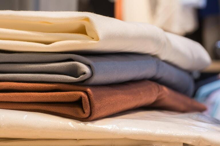 Stack of clothing (chino pants), in clothing shop Stack of clothing (chino pants), in clothing shop