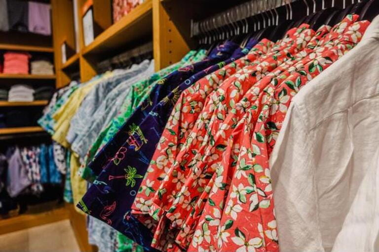 Close up of hawaiian shirts on a clothing rack inside a store in the US