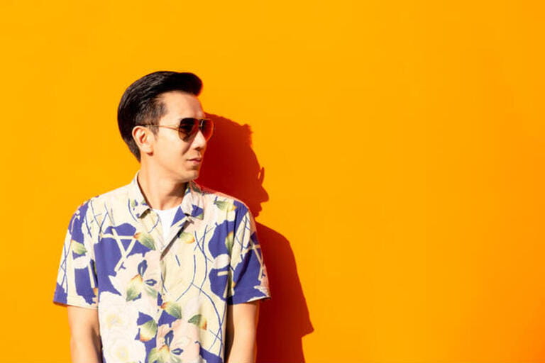 Fashion asian man with sunglasses on colored background. Fashion asian man with sunglasses on colored background.