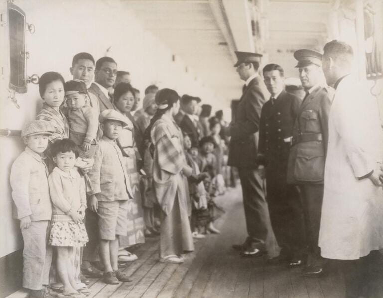 Immigration officials examining Japanese passengers aboard the ship Shimyo Maru, at Angel Island 1931. Immigration Act of 1924 severely restricted Japanese immigration to the U.S.