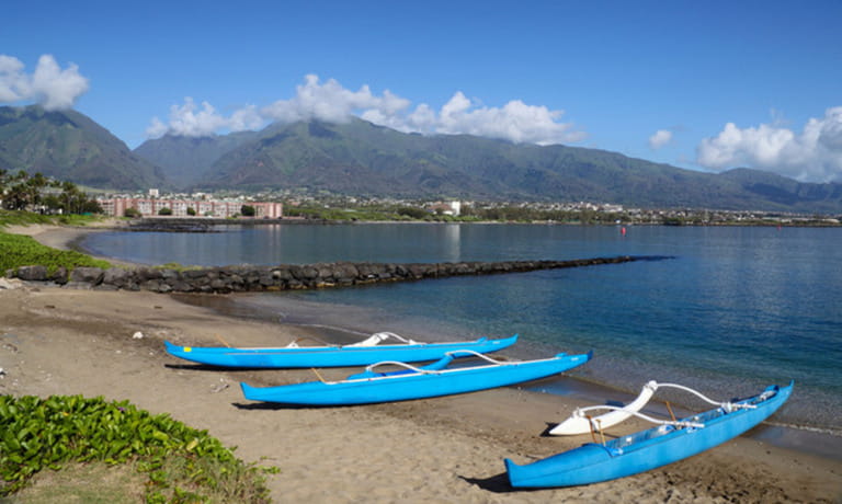 Outrigger canoes beached at Kahului on Maui Outrigger canoes beached at Kahului on Maui
