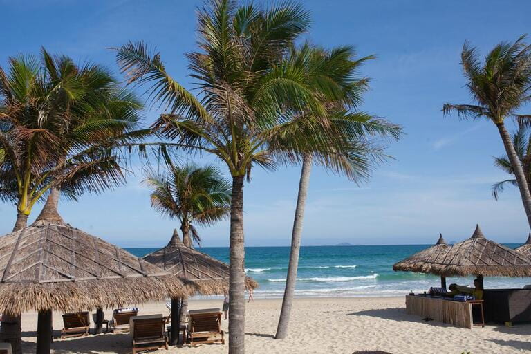 White beach in Vietnam vacation resort with palms on ocean backgrounds White beach in Vietnam vacation resort with palms on ocean backgrounds
