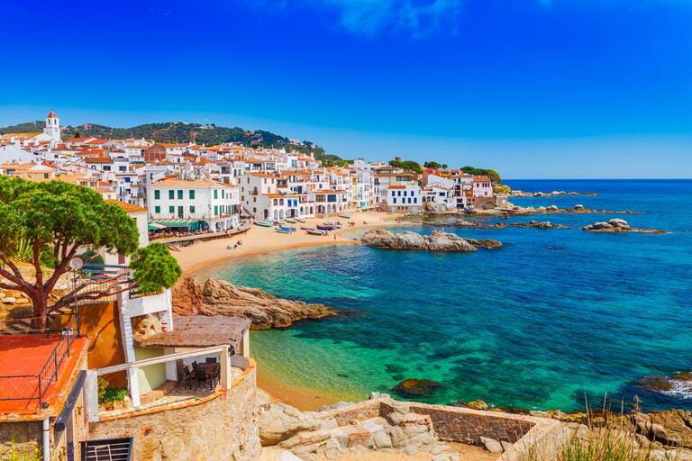 Seascape with Calella de Palafrugell, Catalonia, Spain near Barcelona. Scenic fishermen's village with beautiful sandy beach and clear blue water in beautiful bay. Popular tourist destination in Costa Brava