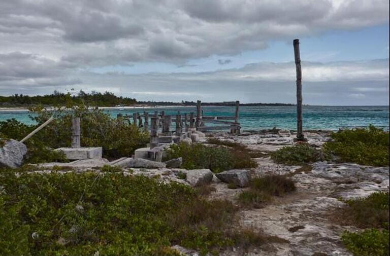 Old jetty abandoned and destroyed by the weather and the weather in Xpu-Ha beach