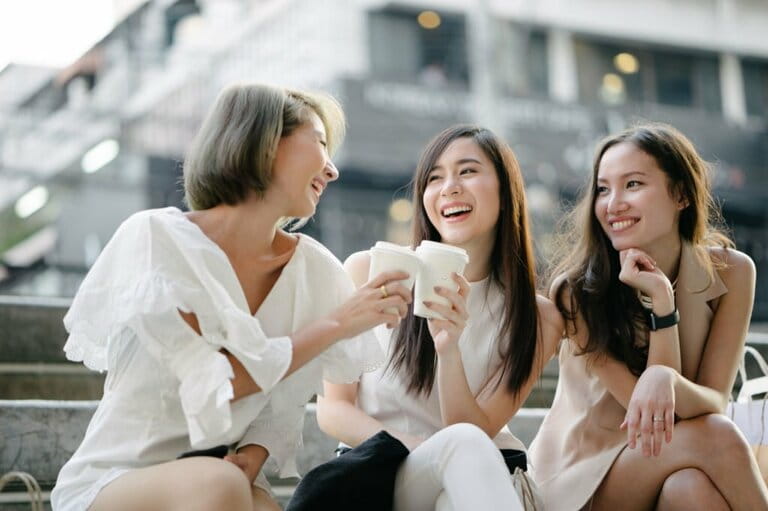Women friends go shopping on the streets of Bangkok